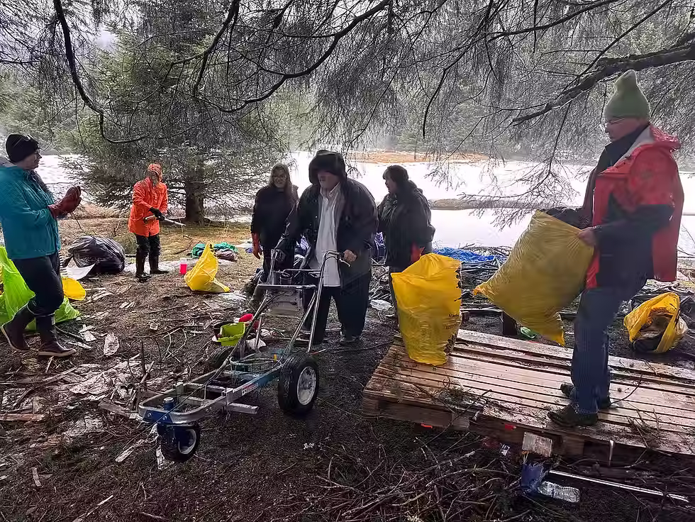 Volunteers clear an abandoned homeless campsite in Lemon Creek during the annual Community Cleanup organized by Litter Free Inc. on Saturday, April 18, 2026. (Mark Sabbatini / Juneau Independent)