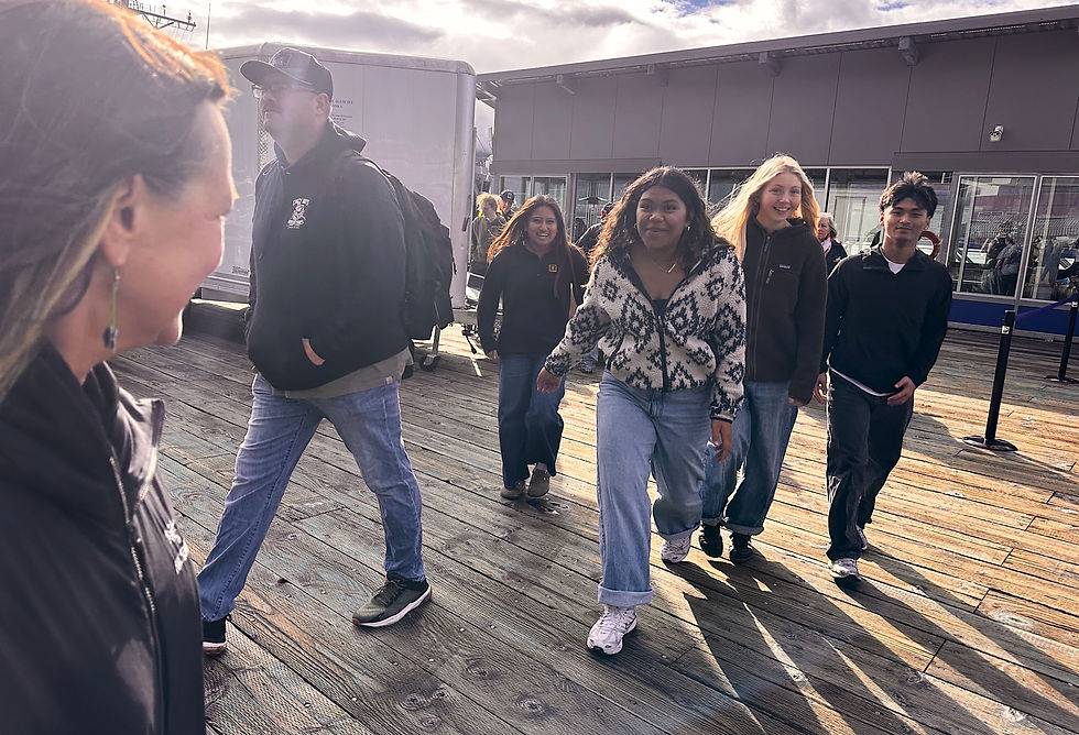 Amy Lloyd, left, a teacher at Juneau-Douglas High School: Yadaa.at Kalé, waits for students in her U.S. government class after a tour of the USS Ted Stevens at the downtown cruise dock on Thursday, Oct. 8, 2026. (Mark Sabbatini / Juneau Independent)
