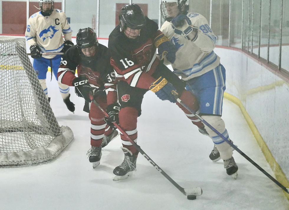 Juneau-Douglas High School: Yadaa.at Kalé sophomore Ryker Nelson (39) and freshman Paxton Willoughby (16) battle with Palmer senior Zander Anderson (76) and sophomore Parker Popowski (88) during the Crimson Bears' loss to the Moose on Saturday, Nov. 22, 2025, at the Treadwell Arena. (Klas Stolpe / Juneau Independent)