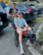 David Cesar, back, and son Michael Cesar pose on David's recumbent trike in July. David hopes to ride and Michael run in the Nov. 1, 2026, New York City Marathon. (Photo courtesy Michael Cesar)