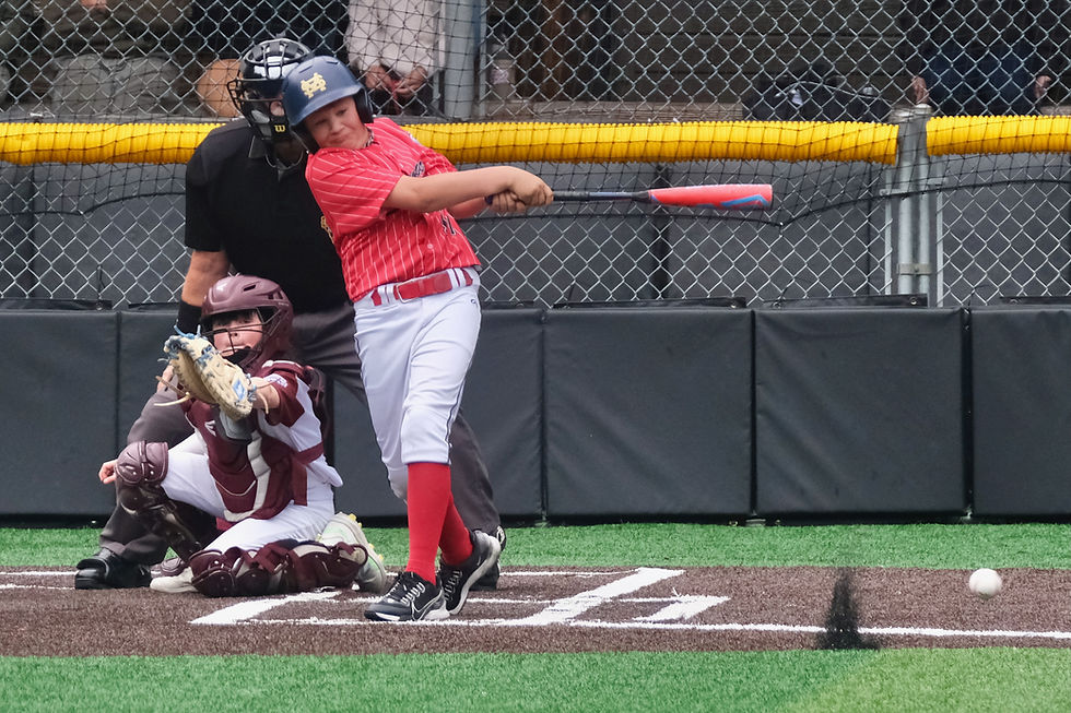 Gastineau Channel Little League All-Star Zackary Ritter connects on the game-ending hit against Ketchikan during the Alaska District 2 Majors Baseball Tournament championship game Saturday at Adair-Kennedy Memorial Park. Juneau won 13-3. (Klas Stolpe / Juneau Independent)