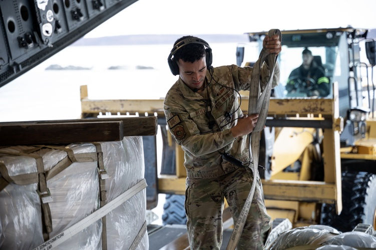 Alaska Air National Guard C-17 Globemaster III aircrew, assigned to the 176th Wing, offload gear and supplies at Bethel, Alaska, while supporting storm recovery operations following Typhoon Halong, Oct. 15, 2025. (Alaska National Guard photo by Staff Sgt. Joseph Moon)