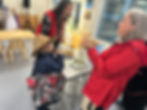 Jaxon Shilts, 6, tries a dried apple while his mother, Rhonda Butler, tries dried kelp served by Jaxon’s aunt, Jamiann Hasselquist, during the official opening of the Sealaska Heritage Institute’s Indigenous Science Building on Monday, Oct. 13, 2025. (Mark Sabbatini / Juneau Independent)