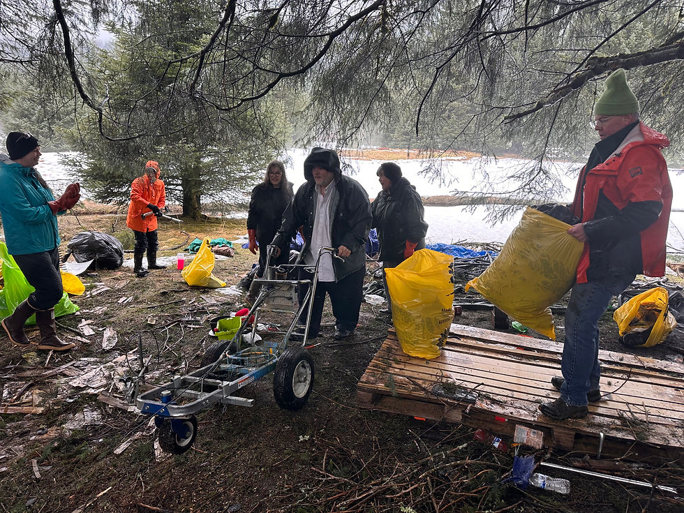 Volunteers clear an abandoned homeless campsite in Lemon Creek during the annual Community Cleanup organized by Litter Free Inc. on Saturday, April 18, 2026. (Mark Sabbatini / Juneau Independent) 