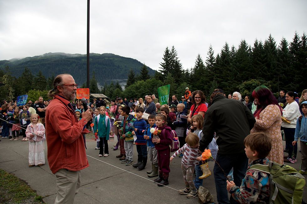 Scott Jonsson, left, greets students during the traditional Wisdom Day welcome for the Montessori Borealis program at the Dzantik'i Heeni campus on Thursday, Aug. 20, 2026. Jonsson was named the new principal of Montessori Borealis and Yaakoosgé Daakahídi High School earlier this year. (Mark Sabbatini / Juneau Independent)
