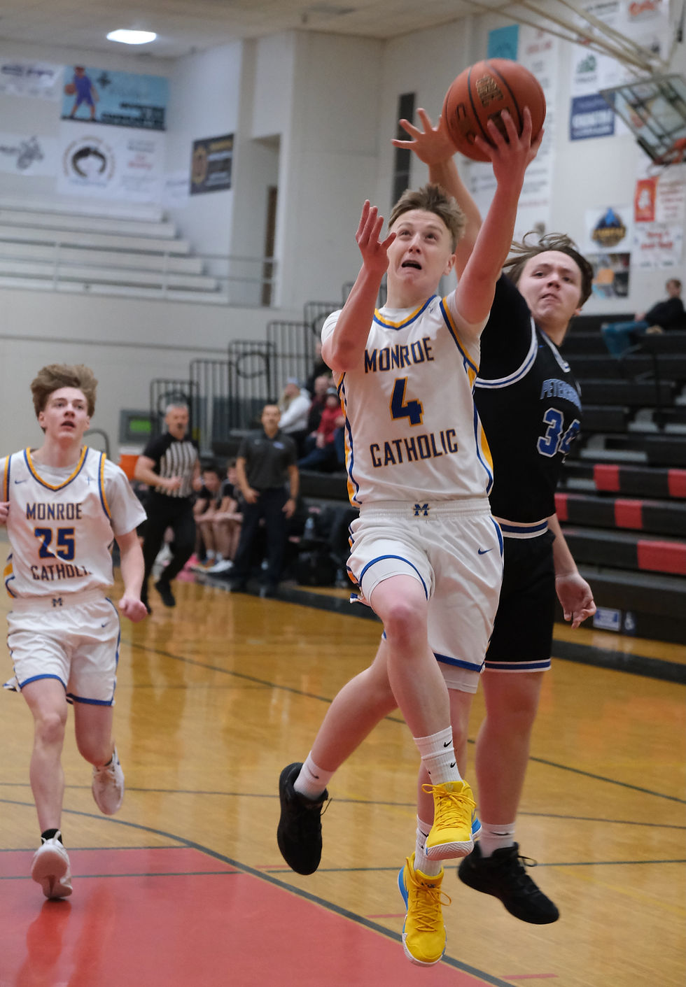 Monroe sophomore Harry Roberts scores against Petersburg during the George Houston Capital City Classic at the GH Gymnasium on Monday, Dec. 29, 2025. (Klas Stolpe / Juneau Independent)
