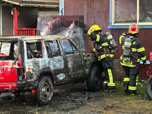 Fire that destroys vehicle spreads to adjacent home in Lemon Creek, extinguished before major damage occurs