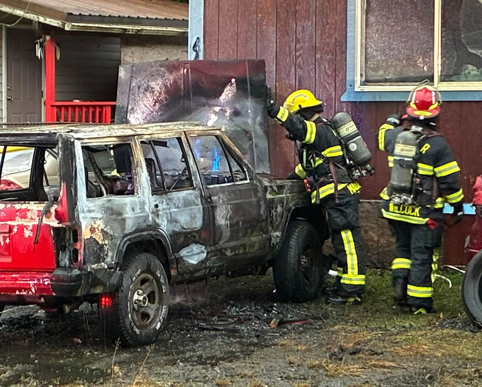 Firefighters work to contain a fire in a vehicle that spread to an adjacent house in Lemon Creek on Wednesday, Oct. 21, 2026. (Capital City Fire/Rescue photo)