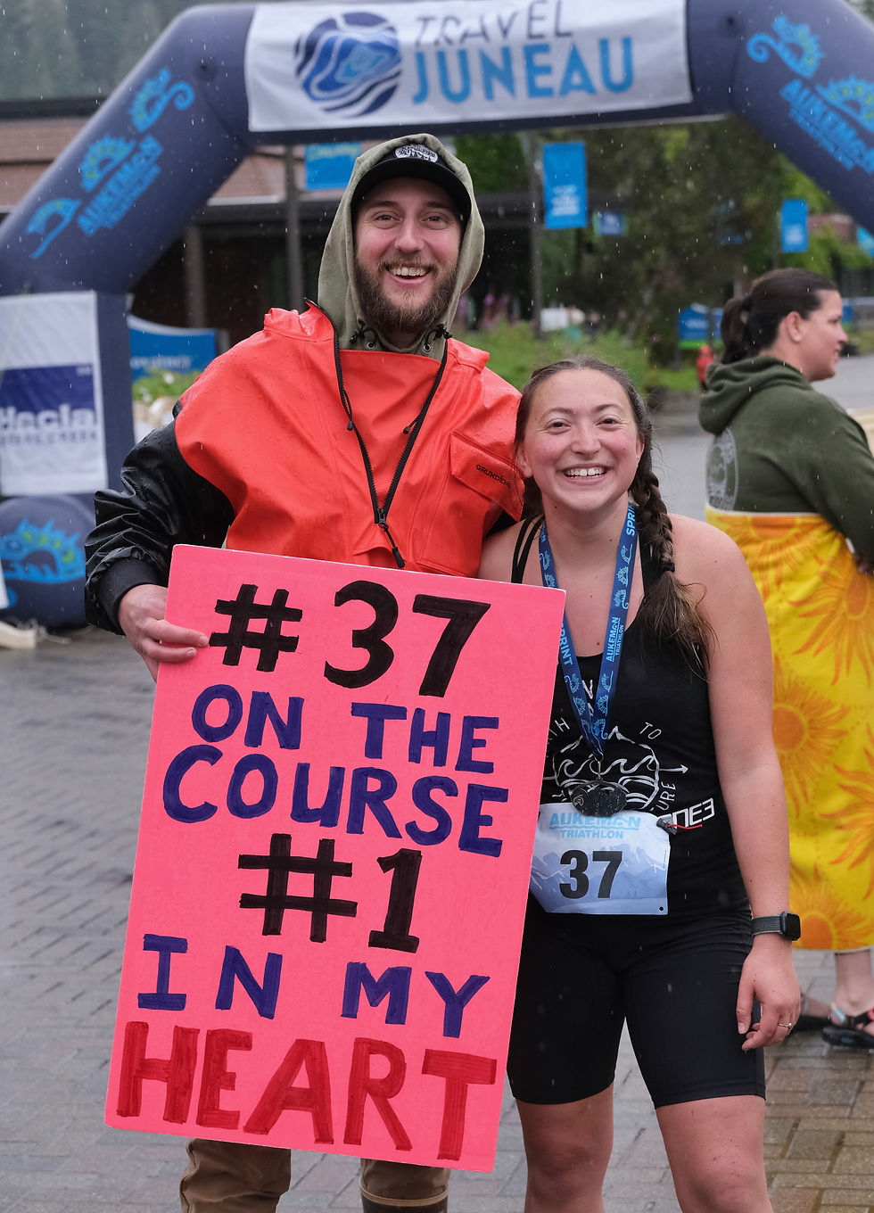 Nicole Linse stands with her biggest fan, boyfriend Julian, at the finish of the 2025 Aukeman Triathlon Sprint course on Sunday, Aug. 3, 2025. (Klas Stolpe / Juneau Independent)