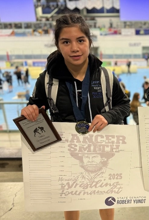 Juneau-Douglas High School: Yadaa.at Kalé sophomore Nixie Schooler won the girls' 107-pound championship and was voted the Girls Outstanding Wrestler in the Lancer Smith Memorial Wrestling Tournament over the weekend at Wasilla’s Curtis D. Menard Memorial Sports Center. (Photo courtesy JDHS wrestling)