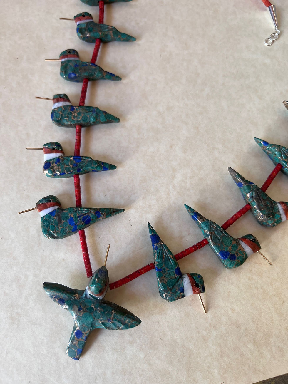 Thumbnail: close up of hummingbird azurite necklace