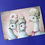 Thumbnail: three white peacocks wearing elegant formal wigs