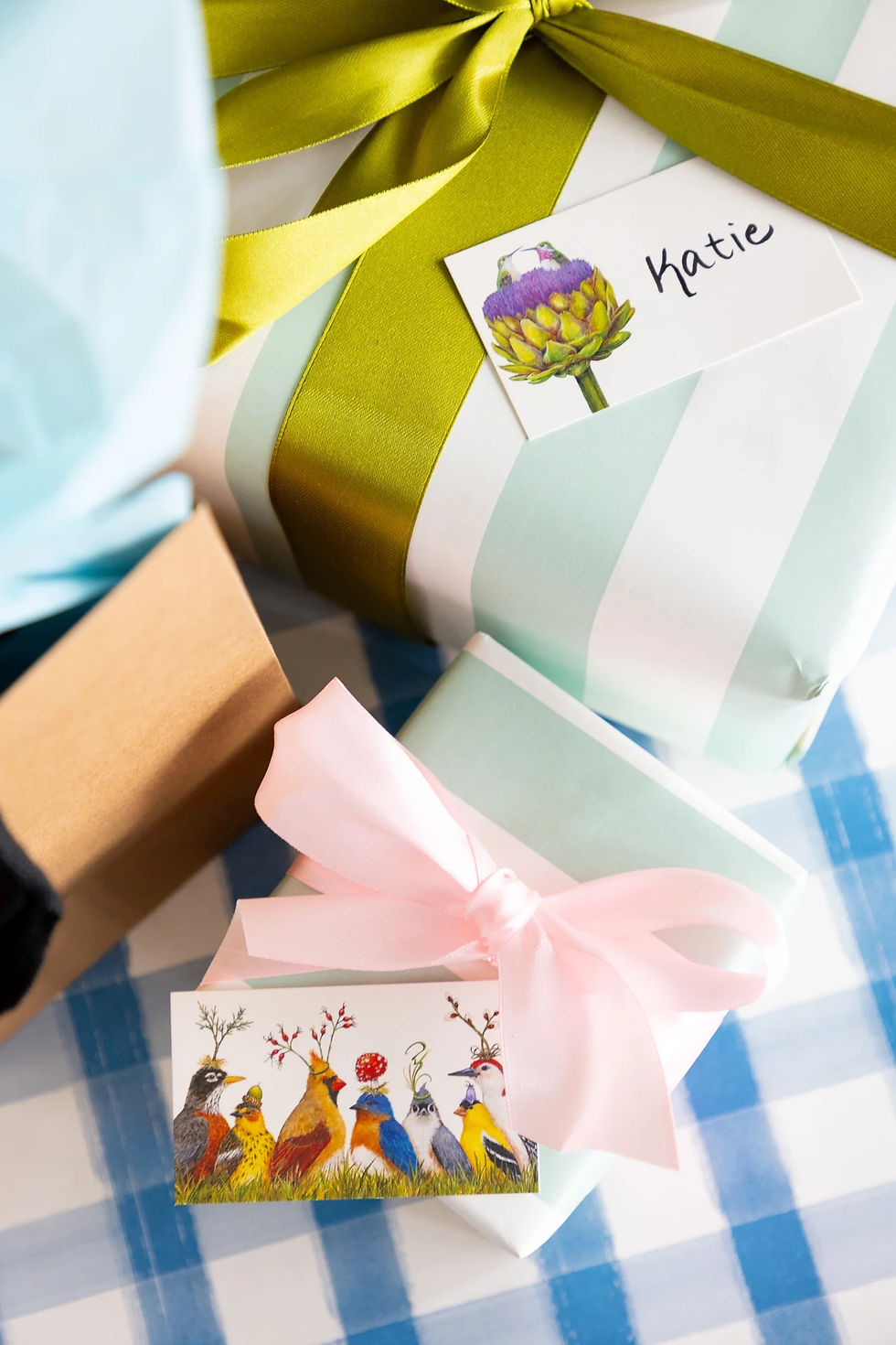 Thumbnail: Tiny notes with whimsical birds wearing botanical hats tucked into a gift box