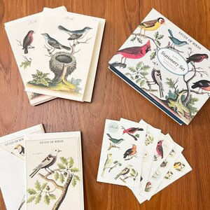 Thumbnail: Closeup of bird notecards, stickers and box cover of stationery set