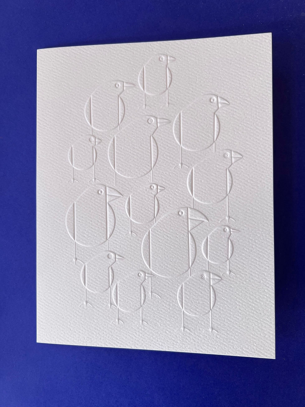 Thumbnail: an embossed image of finches