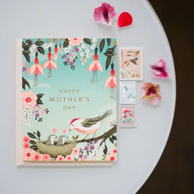 Thumbnail: bird feeding its babies in a nest with the words Happy Mother's Day on the front of the card