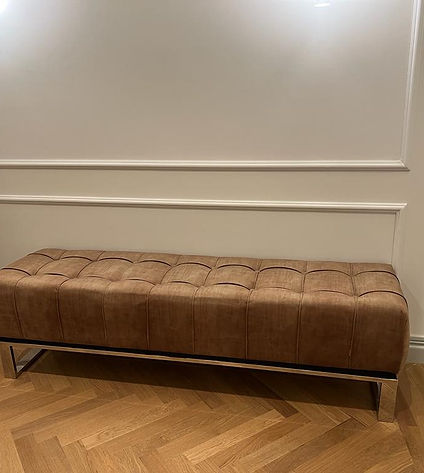 Simple brown bench in white space. 