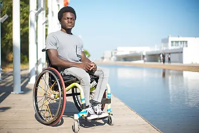 portrait-serious-man-wheelchair-african-american-man-casual-clothes-embankment-squinting-b
