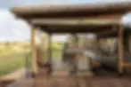 Singita Mara River camp deck overlooking Serengeti Lamai plains Tanzania luxury safari
