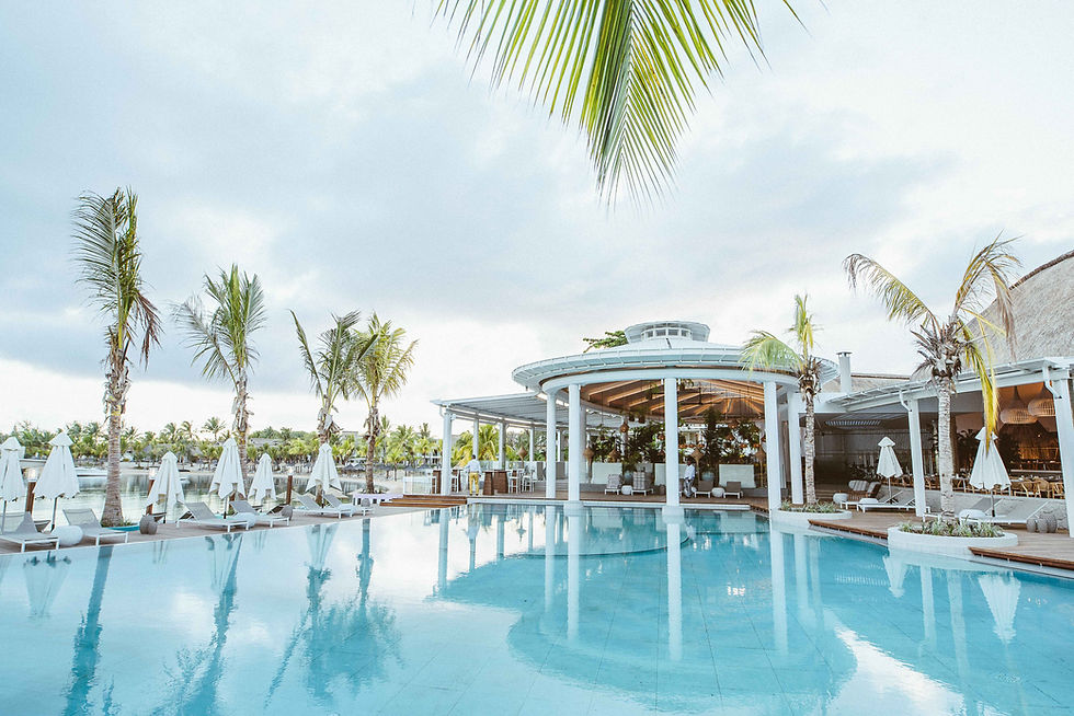 Pool and resort buildings at LUX Grand Gaube on the coast of Mauritius.