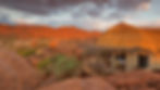 Thatched suite at Mowani Mountain Camp among red granite boulders near Twyfelfontein in Damaraland, Namibia.