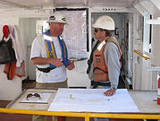 Truston's Marine Construction Supervisor and Ocean Engineer collaborate on a project onsite