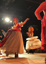 Avant-garde fashion designs made from recycled materials displayed on runway at Carbondale Arts sustainable fashion event.