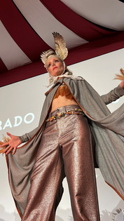 Performer in theatrical owl costume during circus-themed Carbondale Arts Fashion Extravaganza in the Roaring Fork Valley.