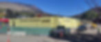 Panoramic view of the Basalt Center Circle The Midland Residences construction site, with Shaw Construction fencing, earthwork in progress, heavy machinery on site, and surrounding mountain backdrop under dramatic Colorado skies.