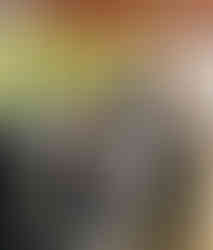 Z Group team closely gathered around a model-building exercise on a shaded patio during the Moab retreat.