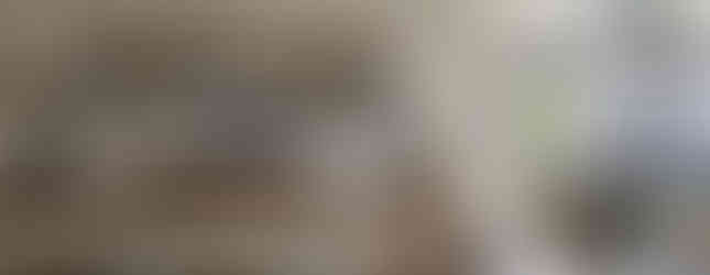 Artful dining room in Ikigai Residence with mid-century modern chairs, layered pendant lighting, and a Japanese folding screen, embodying the home’s curated and contemplative aesthetic.