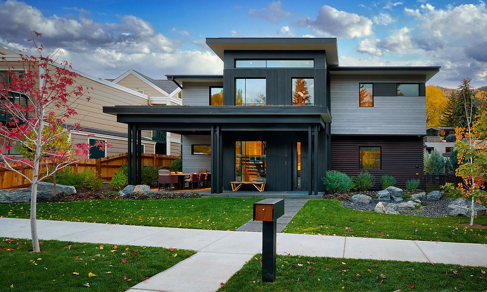 Modern Aspen mountain home Ikigai featuring clean contemporary lines, expansive floor-to-ceiling glass, and seamless indoor-outdoor living set against the Rocky Mountains.