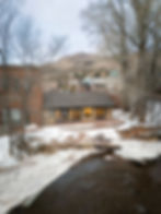 Basalt Riverfront Studio along Roaring Fork River in winter, adaptive reuse commercial architecture in Colorado