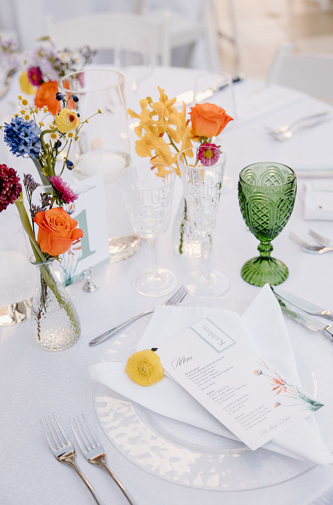 Minimalistic table setting with a personalized menu as the center piece