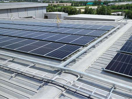 Solar panels installed on the roof of a large commercial building