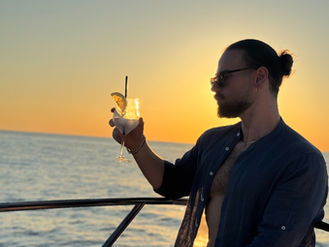 Relaxed atmosphere on catamaran during sunset tour in Palermo