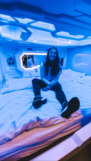 Girl inside a pod room at a hostel in iceland