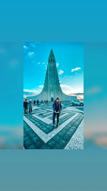 Girl standing in front of Hallgrimskirkja, Iceland