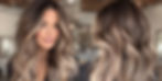 Front and back photographs of a woman with lived in highlights using foilyage technique on long brunette hair