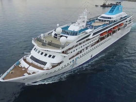 Cruise ship available for charter or sale, exterior view of passenger vessel at sea or in port