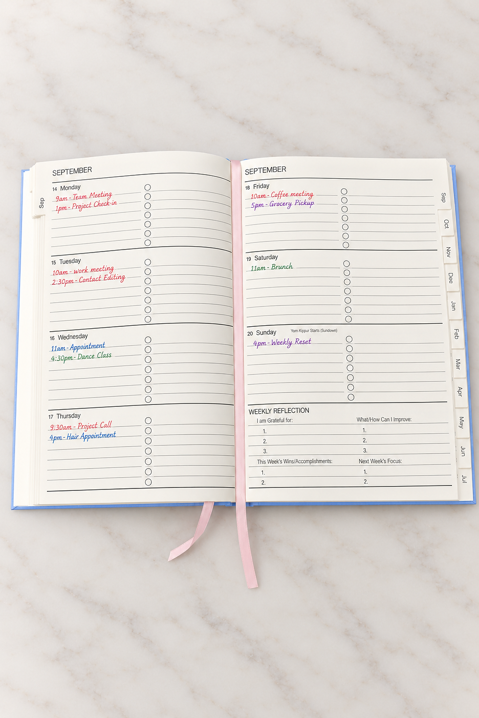 Campbell Creations weekly planner with work and personal commitments color coded