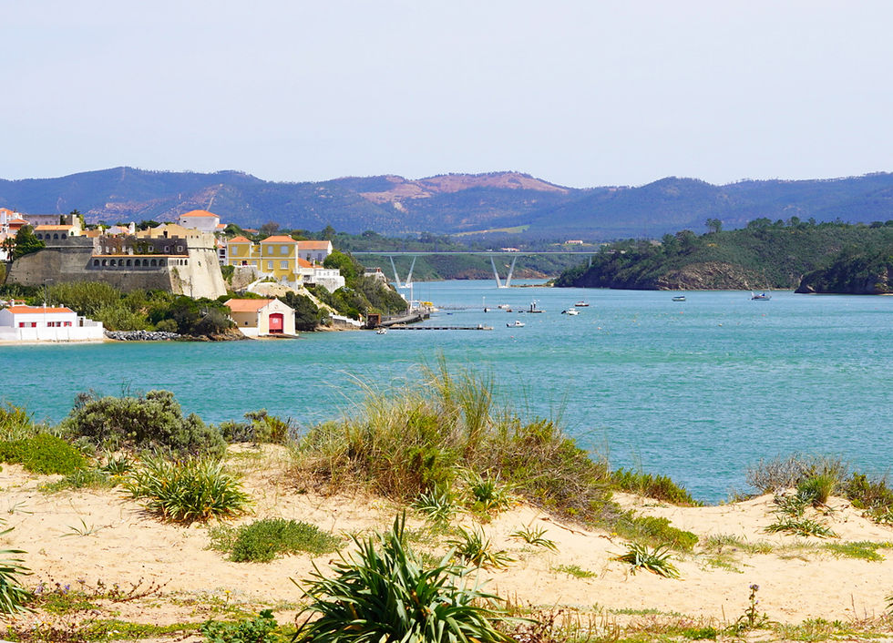 photo of vila nova de milfontes next to the mira river