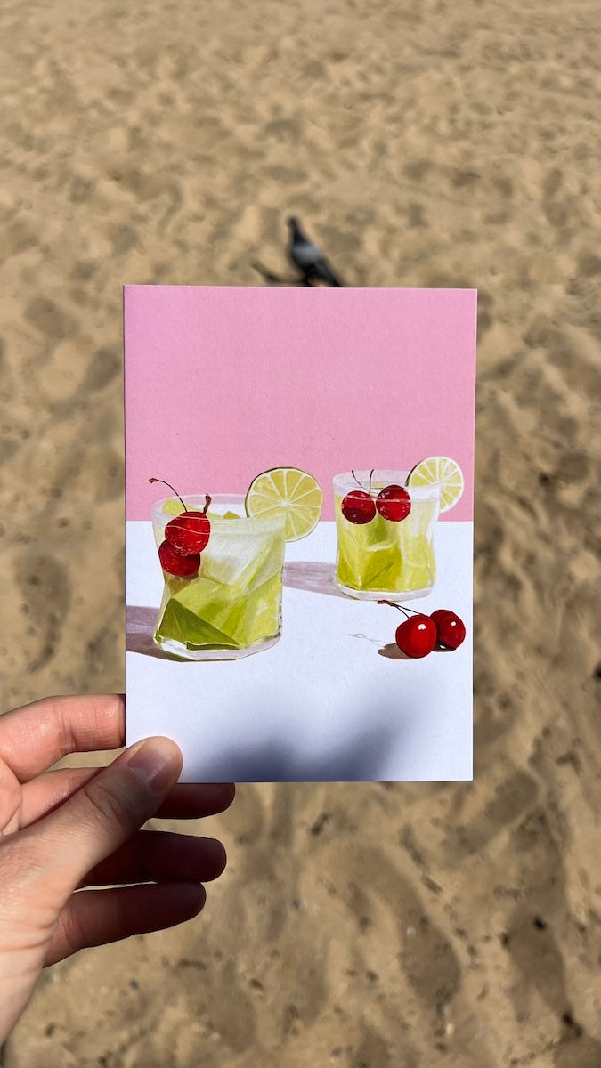 Thumbnail: Green Melon Cooler cocktail with cherries, greeting card on pink and white background