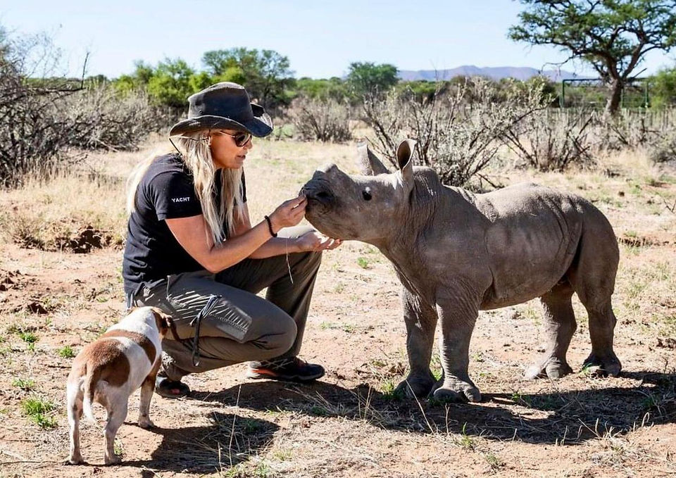 Marlice van Vuuren with baby rhino