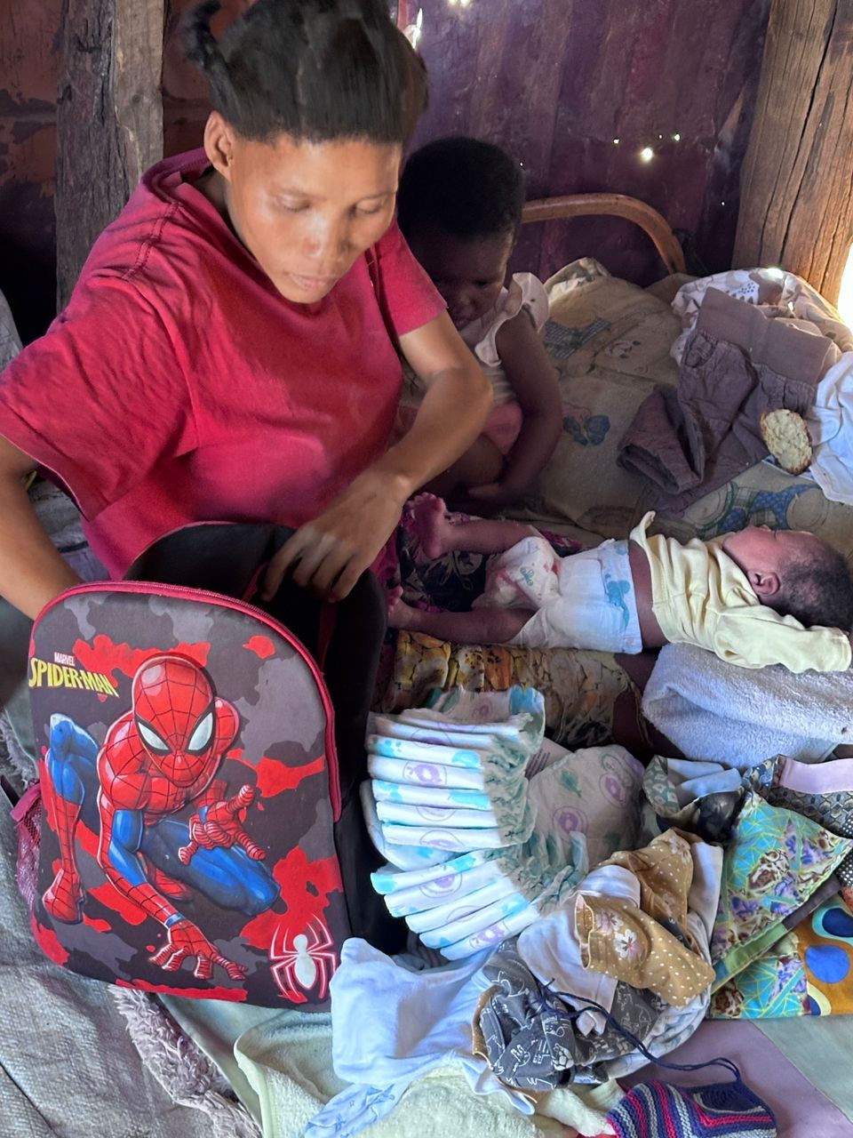 Woman changing a baby's diaper