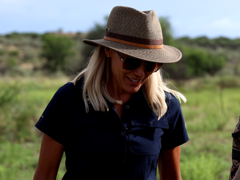 Conservationists tending to a leopard