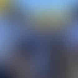 Teacher displaying a hydroponic system to group of children