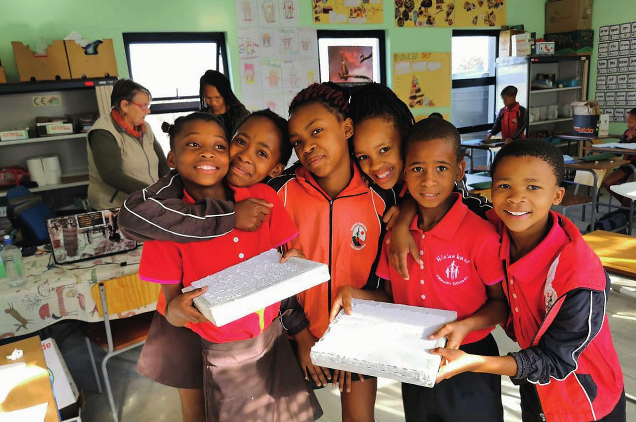 Children receiving school stationary