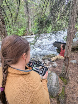 Kay and the monitor, on the set of To Solitude
