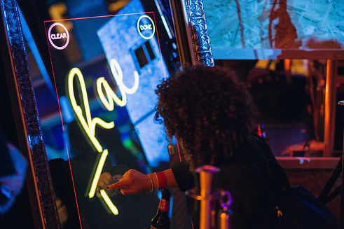 Person using a magic mirror photo booth - MAgic mirror hire Essex - MMENT